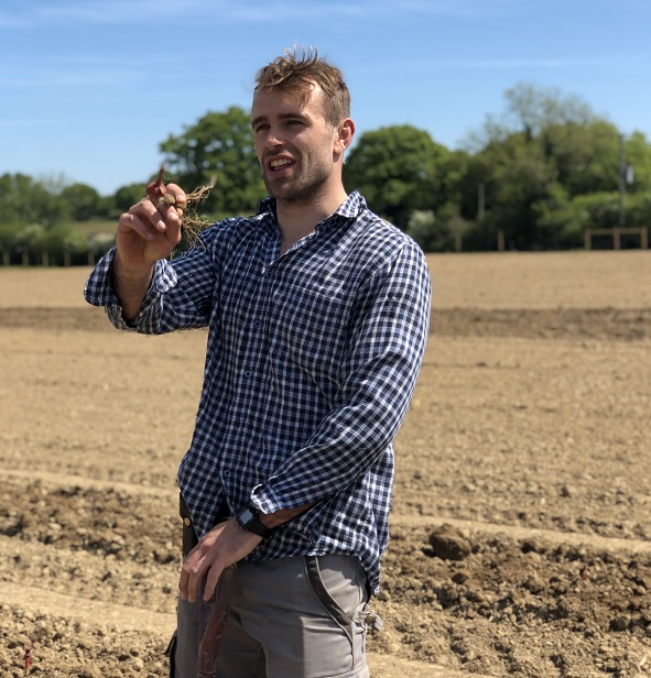 Joe talking in vineyard